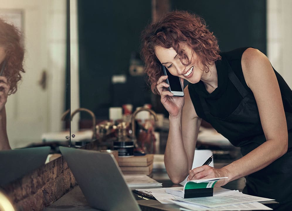 Woman on phone scheduling appointment