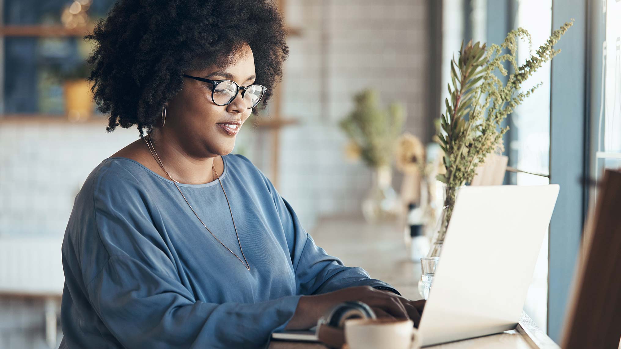 Woman working at laptop in office